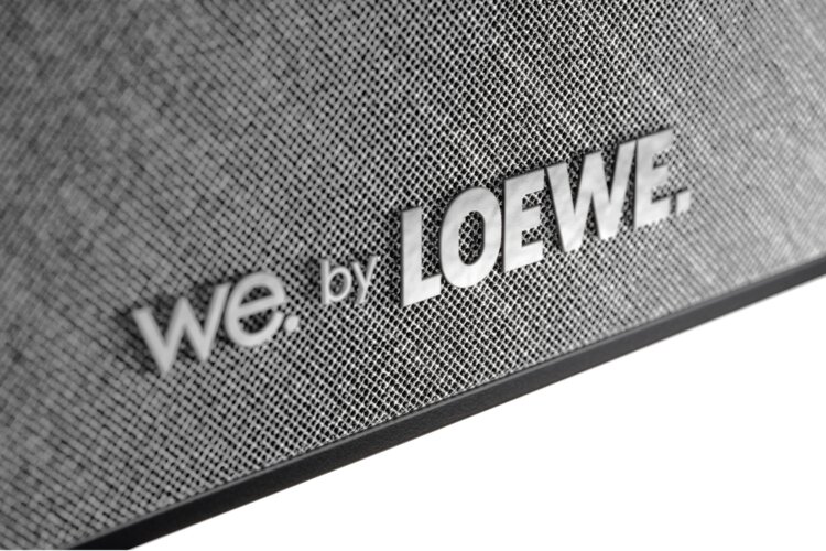 Close-up of the front of the We. BOOST center speaker with the We. by Loewe logo