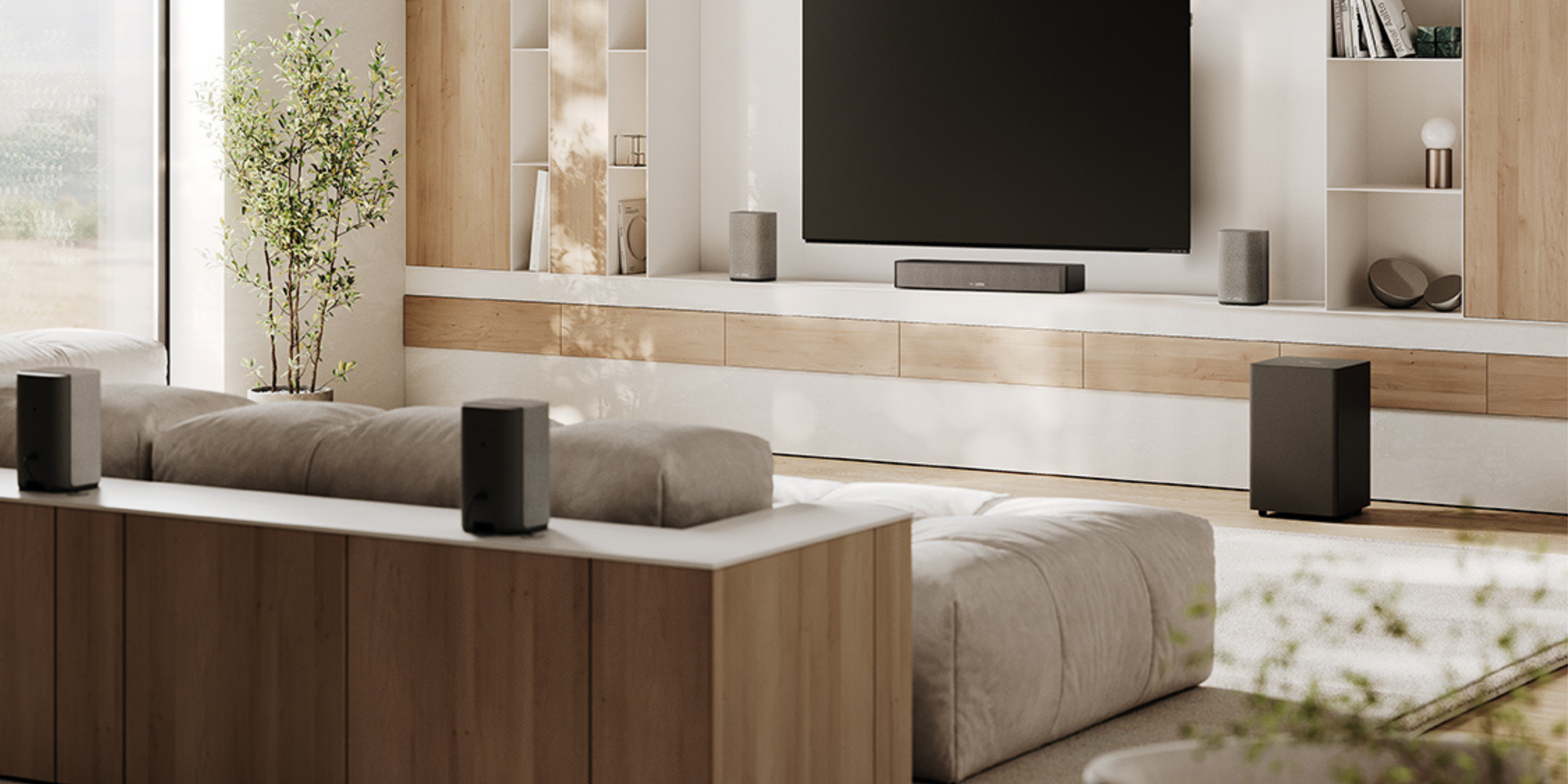 We. BOOST center speaker and We. BOOST in the living room