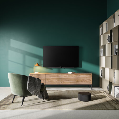 Loewe klang Sub5 und Loewe bild i im Wohnzimmer mit grüner Wand