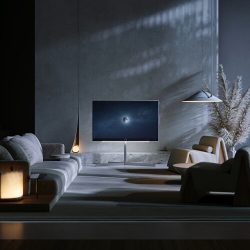 Loewe stellar 65 dr+ lava OLED TV in schönem Wohnzimmer – Premium Fernseher mit Beton-Lava Rückwand und hochwertiger Verarbeitung