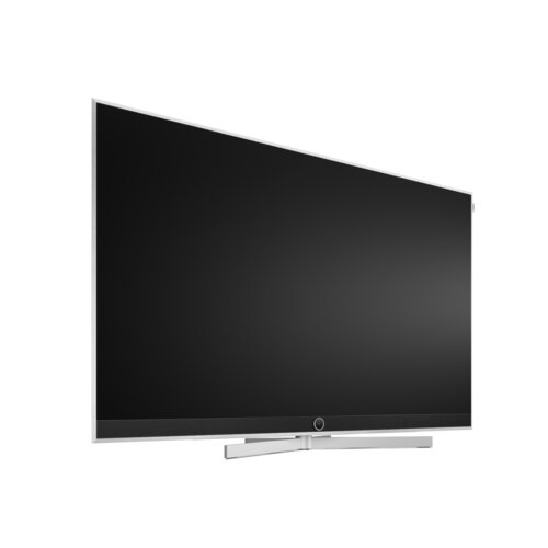 Loewe stellar 65 dr+ concrete OLED TV schräg von vorne mit schwarzem Bildschirm – High-End OLED Fernseher mit Premium Materialien